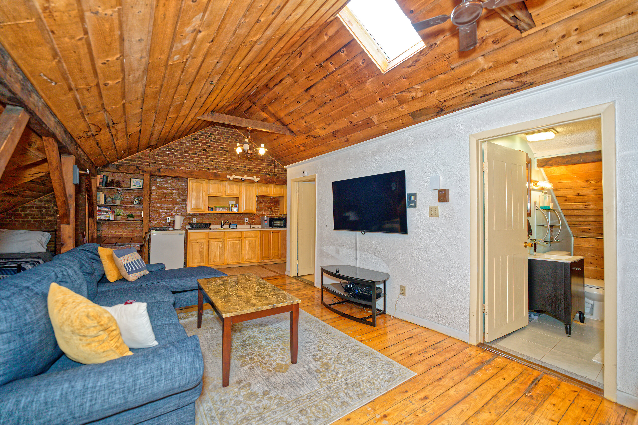 Wood paneled loft living room